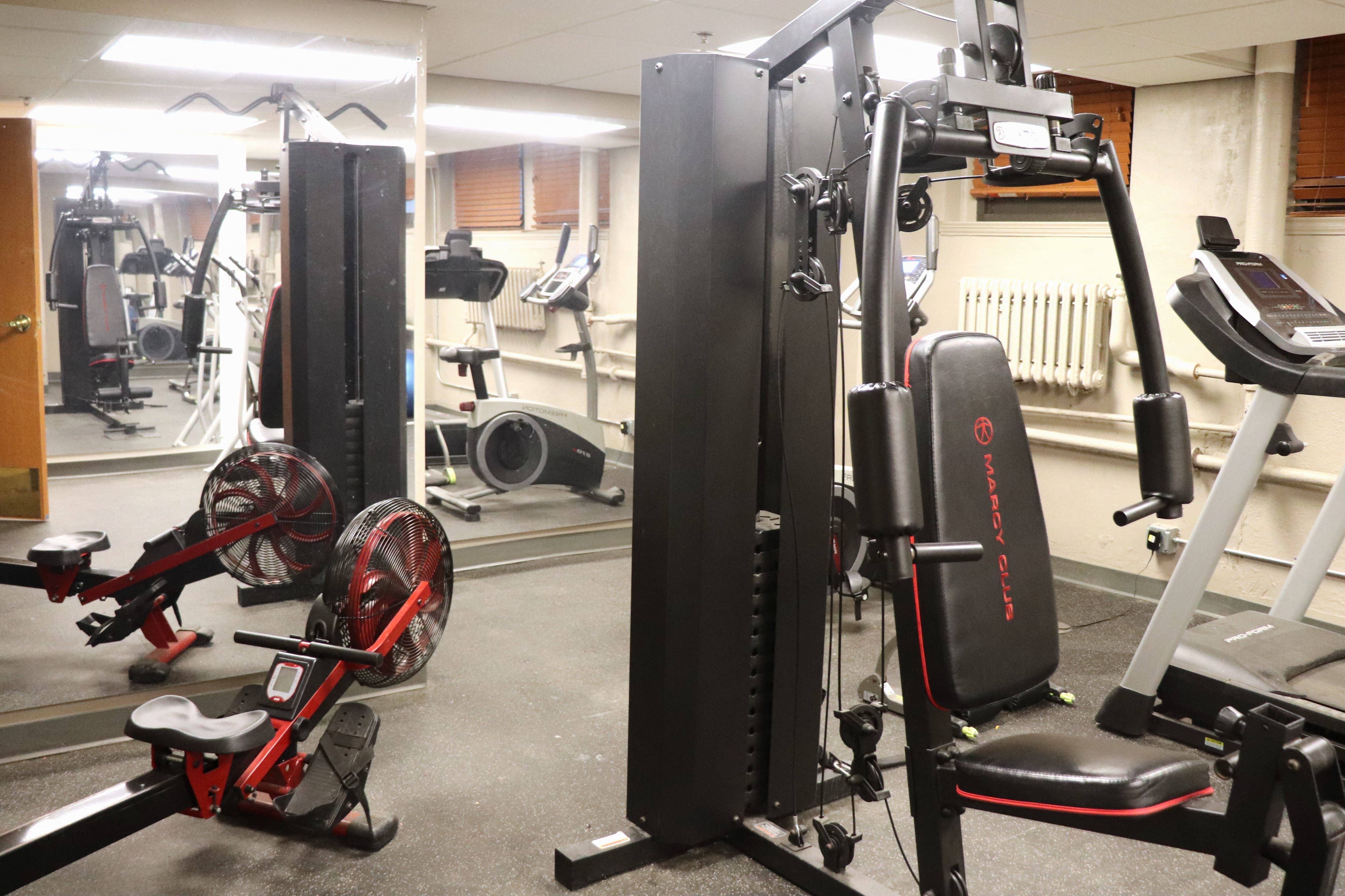 a gym with weights and other equipment in it