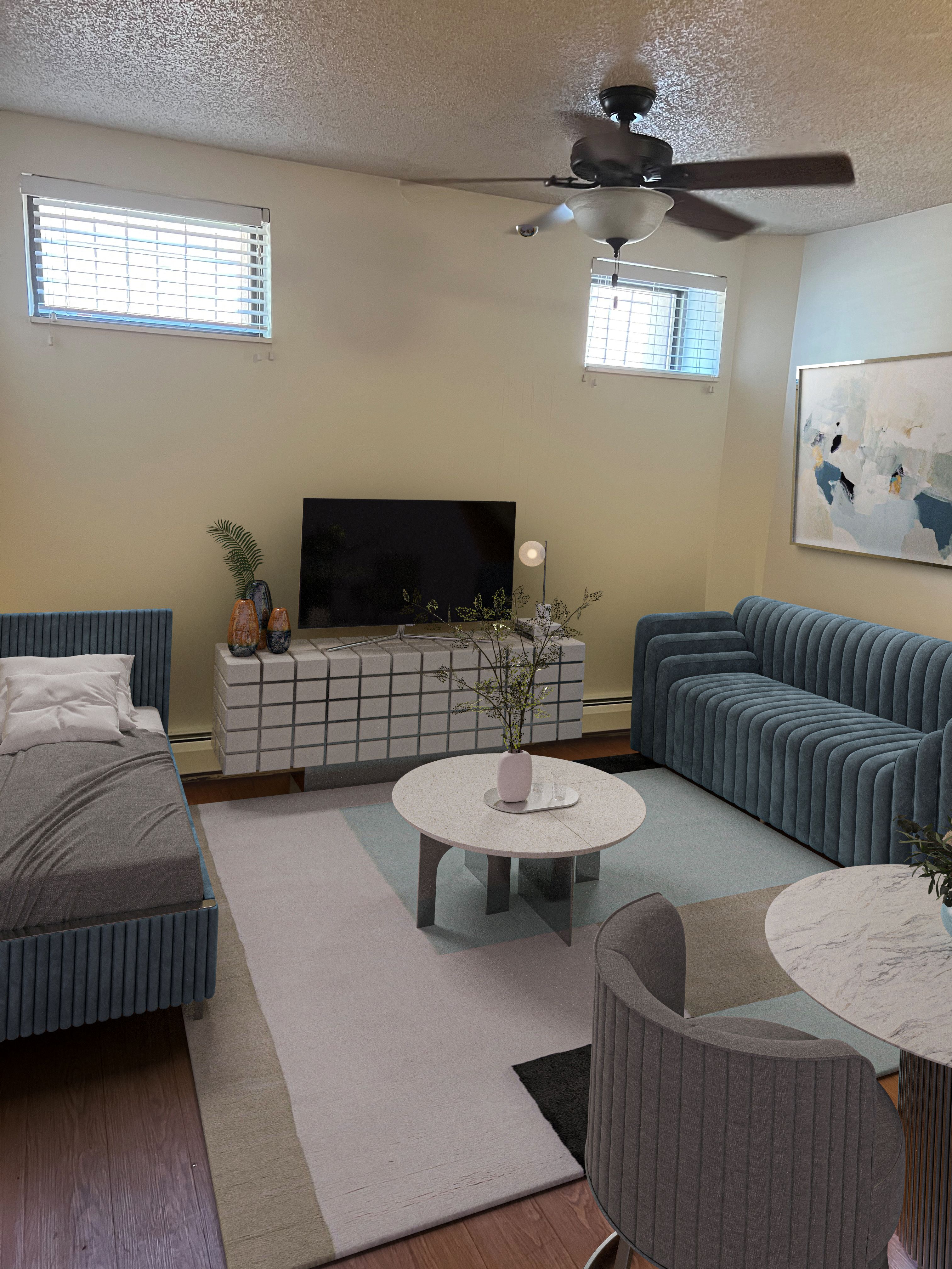 a living room with couches and a table and a television