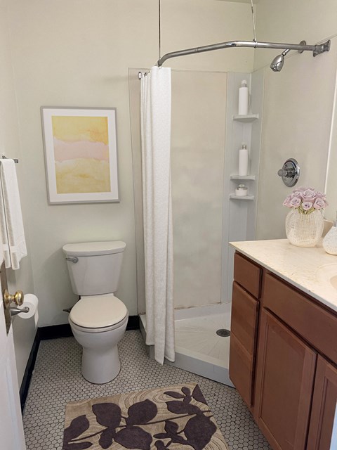 a small bathroom with a toilet and a shower