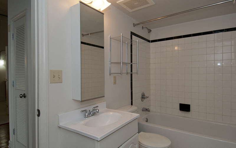 a bathroom with a sink and a tub and a toilet