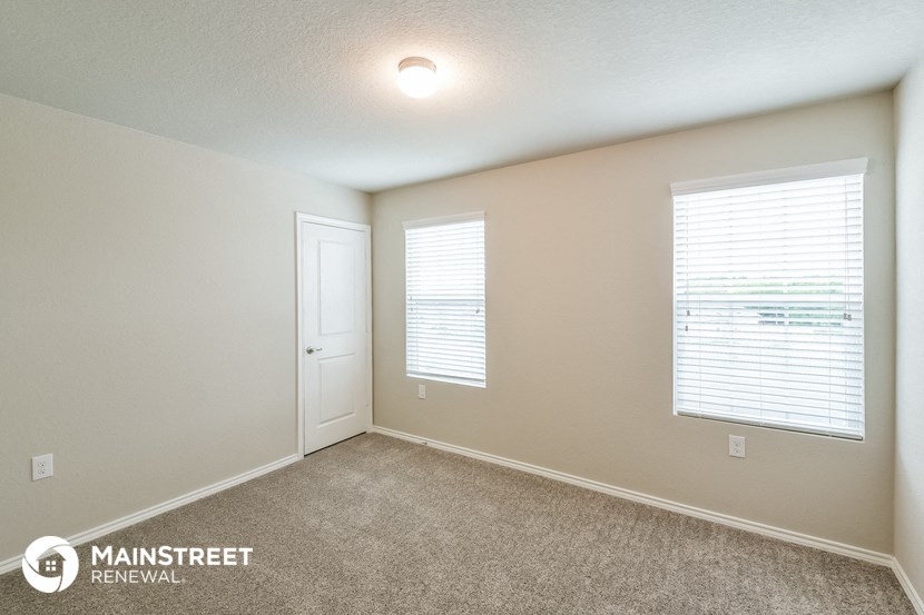 the upstairs bedroom has a door to the ensuite bathroom