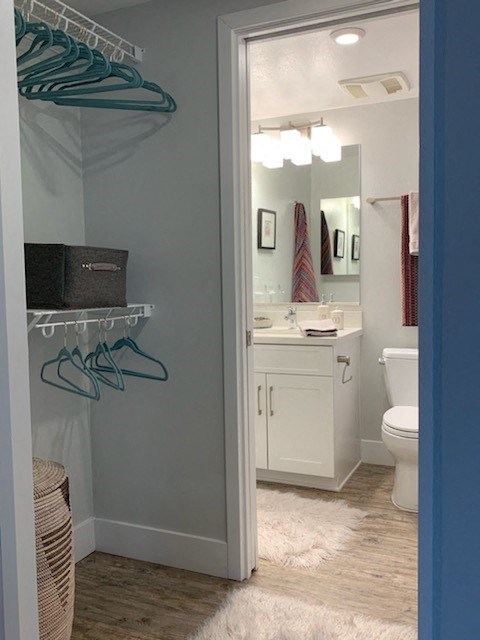 a bathroom with a shower and a toilet and a sink
