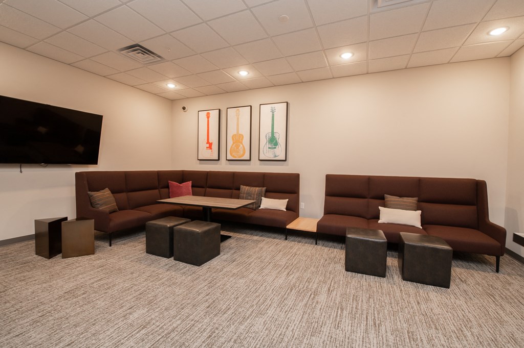 a living room with couches and a tv