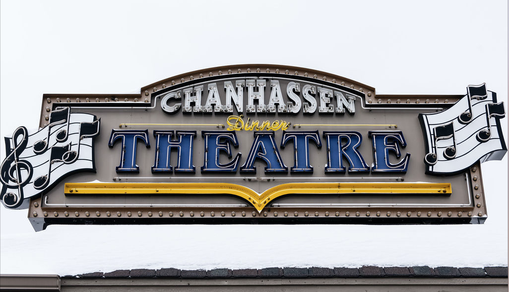 a theater sign on the side of a building