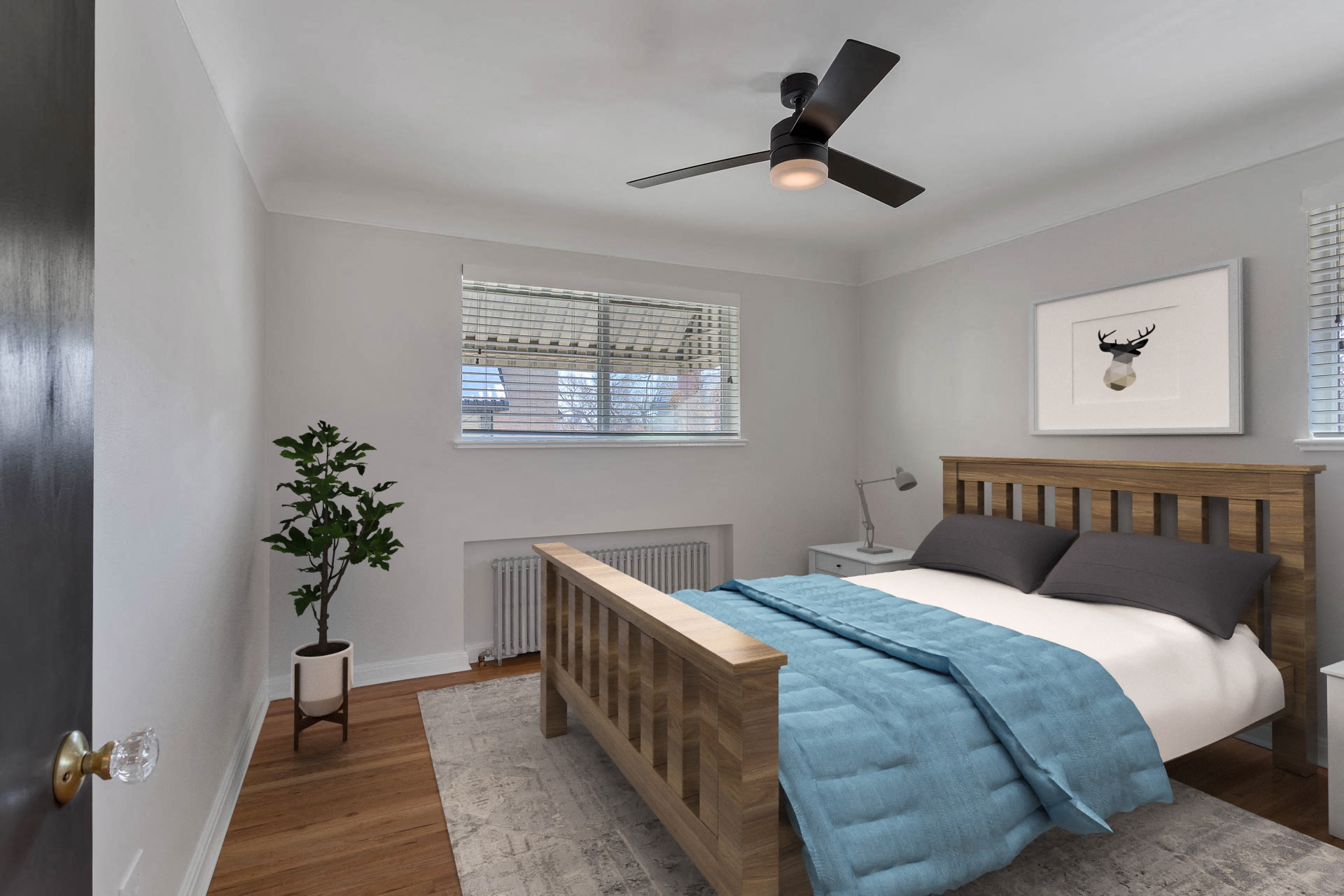 a bedroom with a bed and a ceiling fan