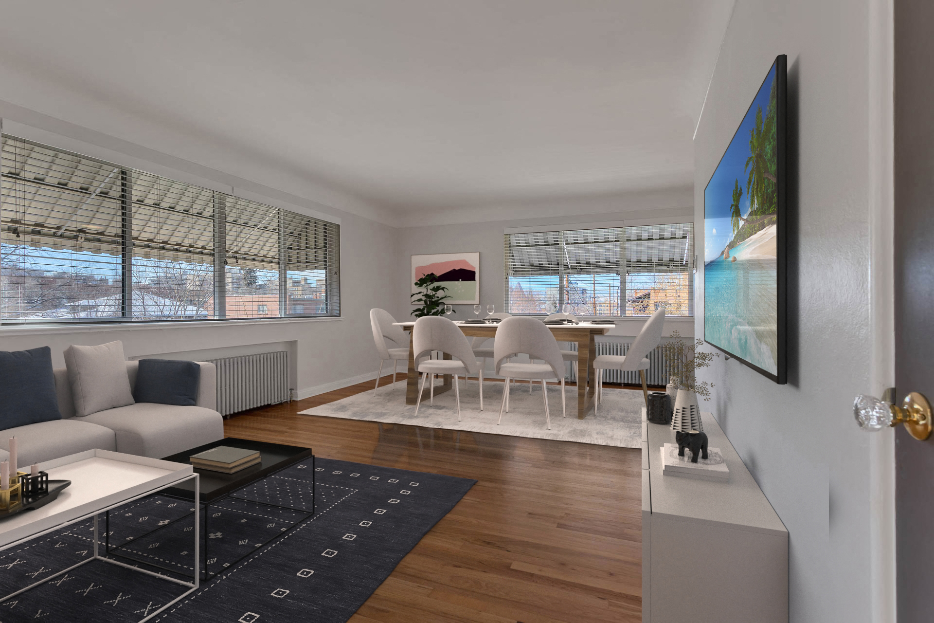 a living room and dining room with a table and chairs