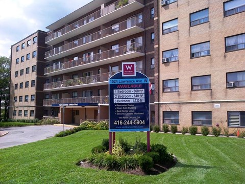 a building with a street sign in front of it