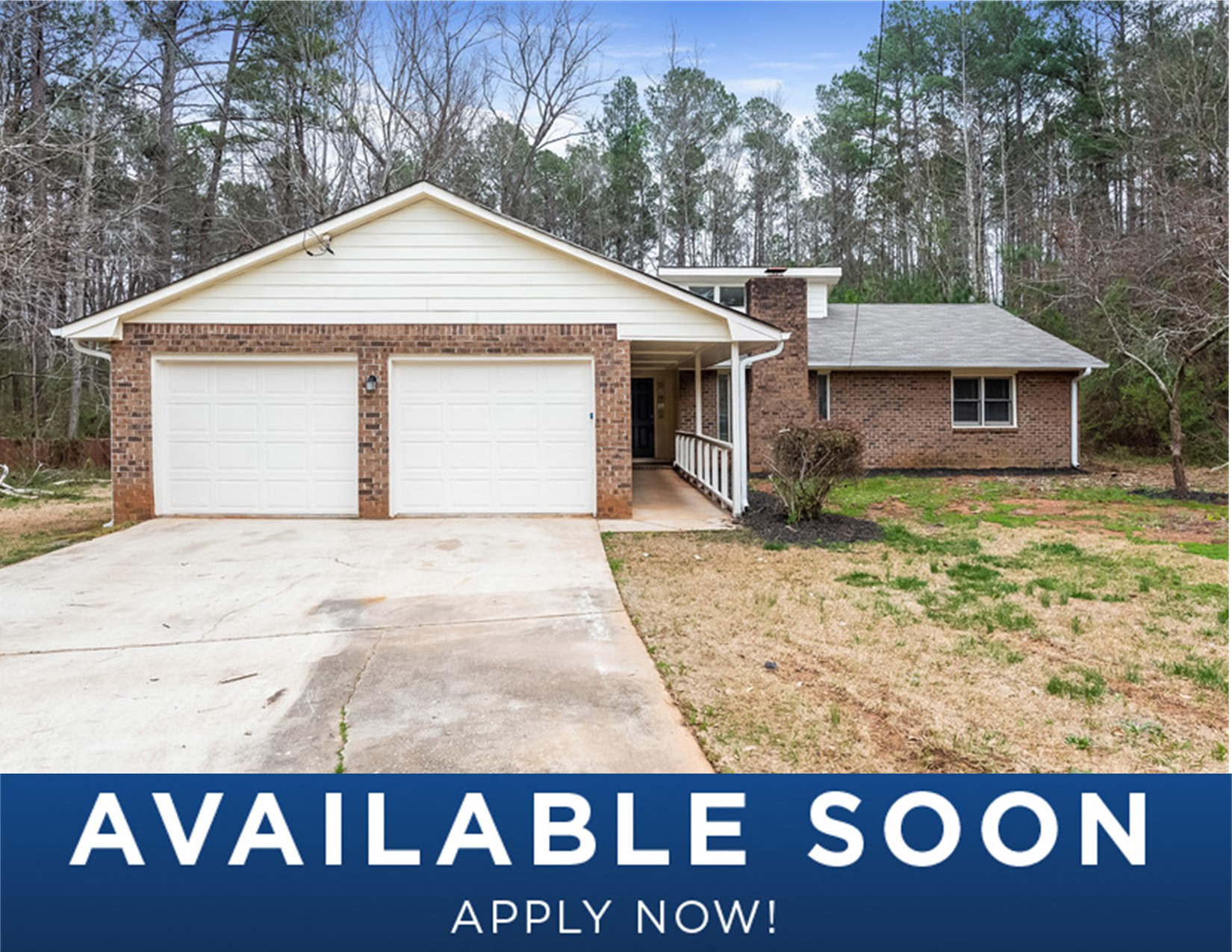 a home with a white garage door and a driveway