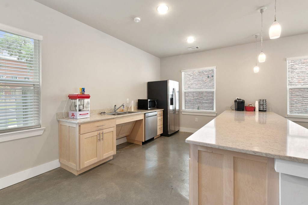 a kitchen with a counter top and a refrigerator