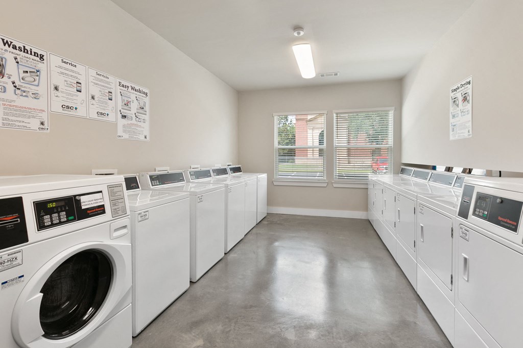 the preserve at cardinal courts laundry room with washes and dryers