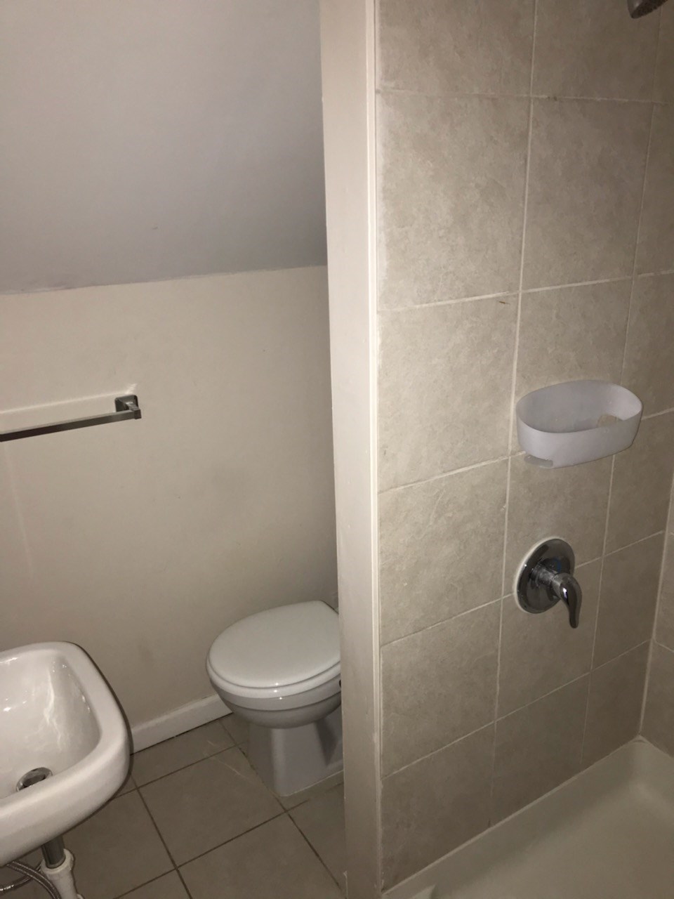 a small bathroom with a toilet and a sink