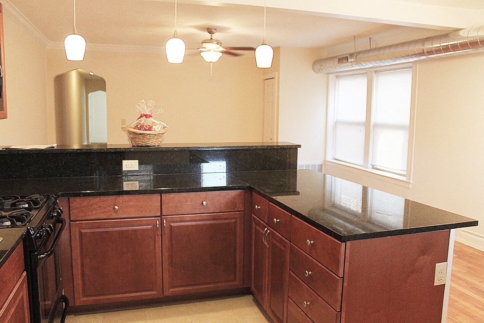 a kitchen with a counter top and a stove