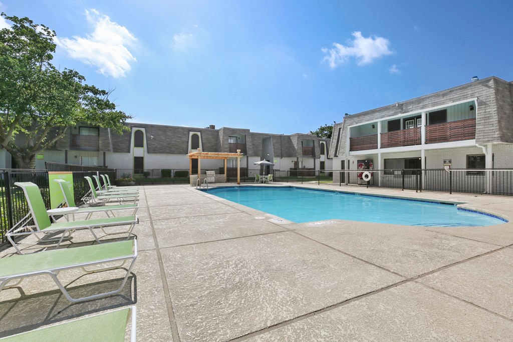 our apartments have a large pool and lounge chairs