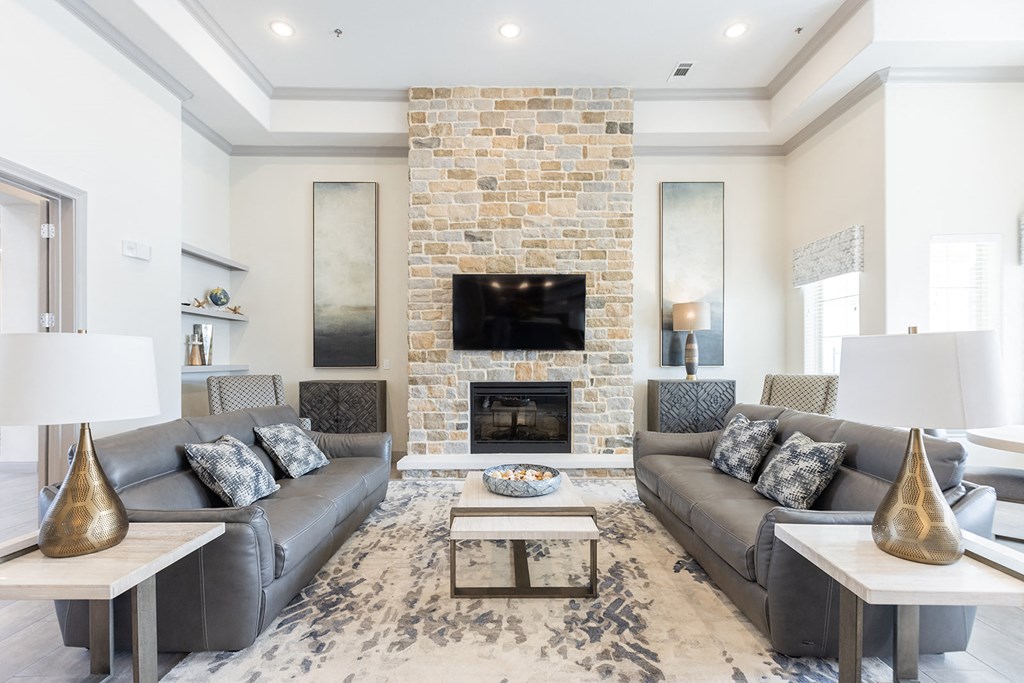a living room with couches and a fireplace
