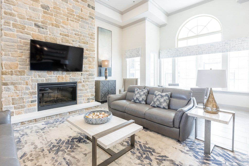 a living room with a couch and a fireplace