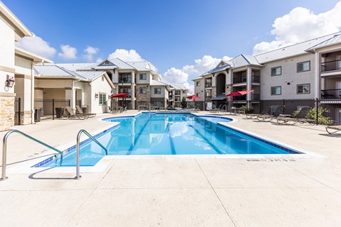 the preserve at ballantyne commons pool with apartment buildings