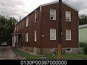 a large red brick building with windows on it