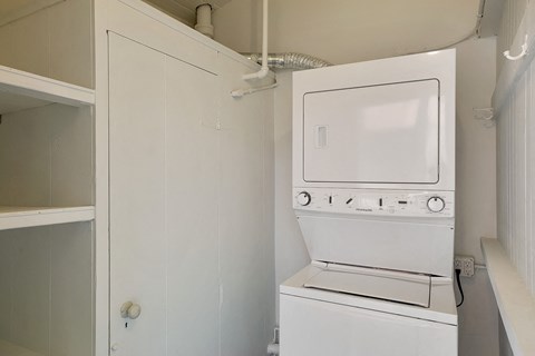 a small laundry room with a washer and dryer