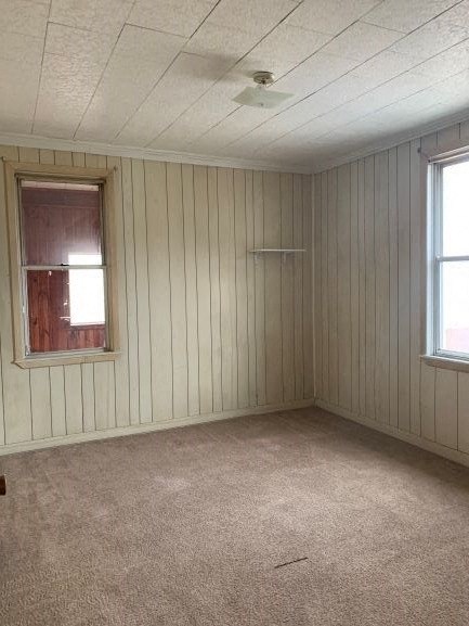 A room with a window and a ceiling fan.