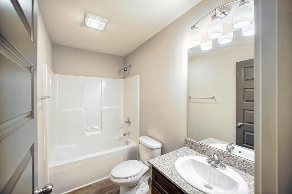 a bathroom with a sink toilet and a shower