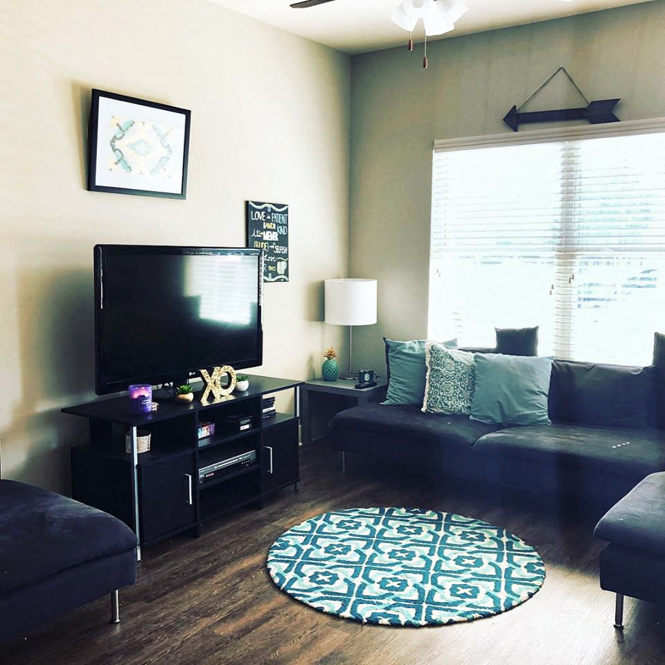 a living room with a couch and a tv