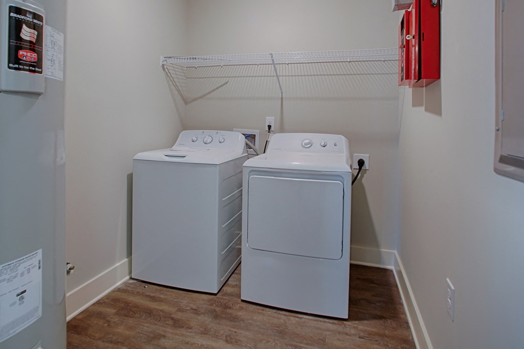 two washer and dryers in the laundry room of a home