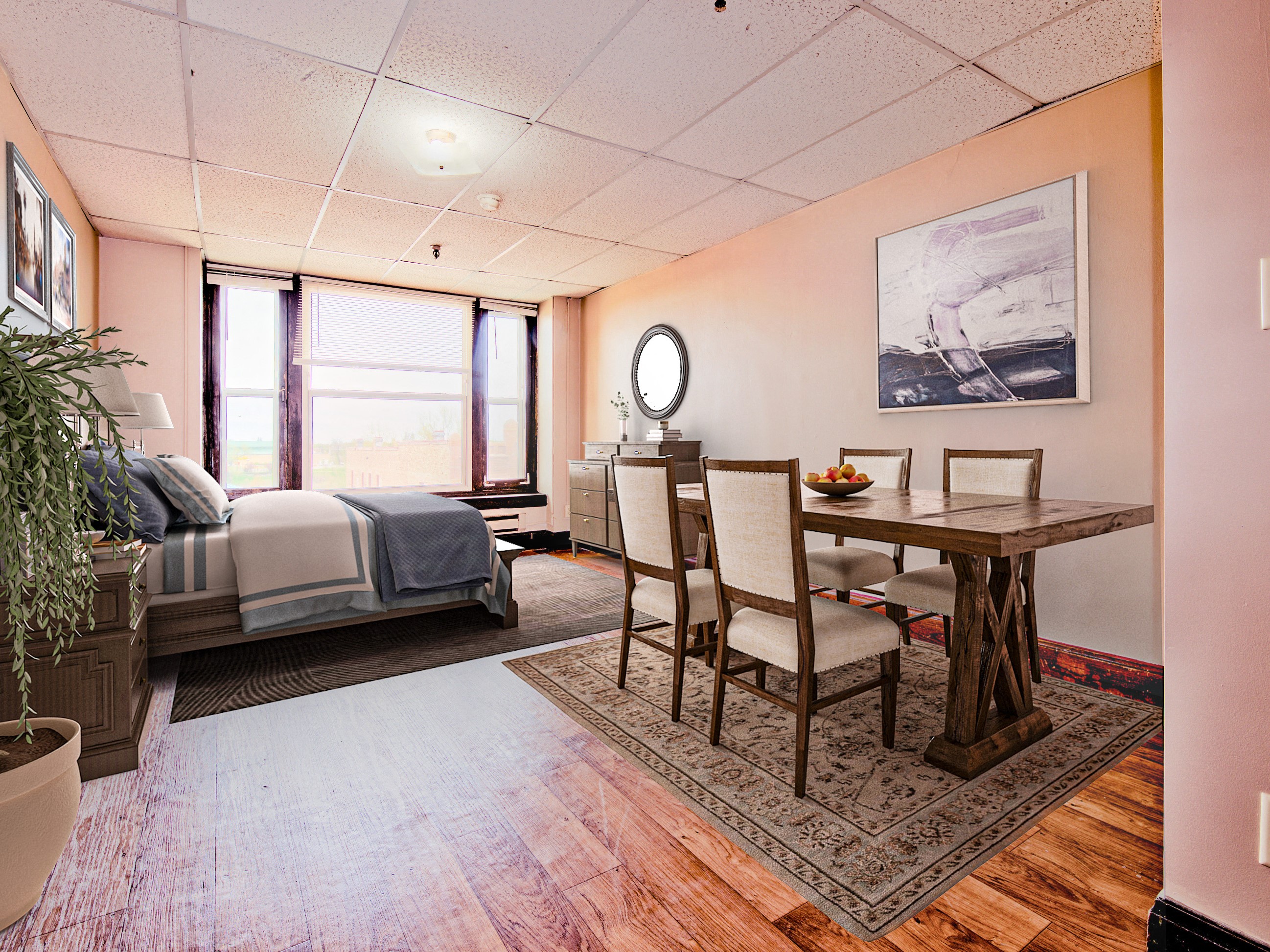 a bedroom with a bed and a dining room table with chairs