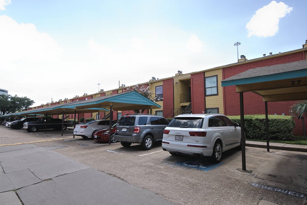 the parking lot is full of cars in front of a building