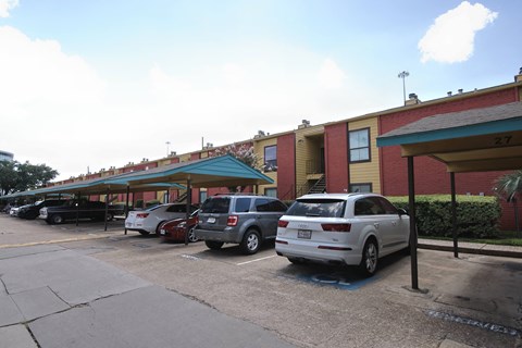 the parking lot is full of cars in front of a building