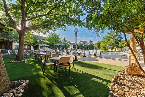 A sunny day at the outdoor restaurant with tables and chairs.