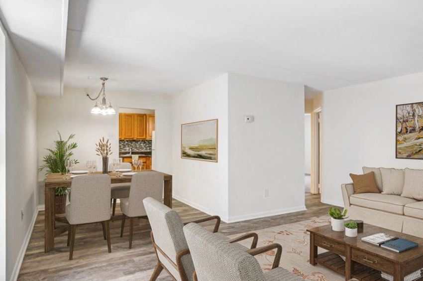 a living room and dining room with a couch and a table