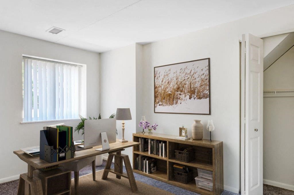 a home office with a desk and a computer