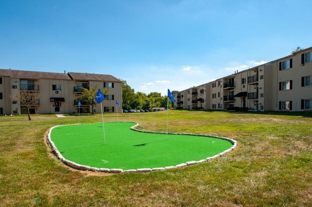 a mini golf course in the middle of an apartment complex