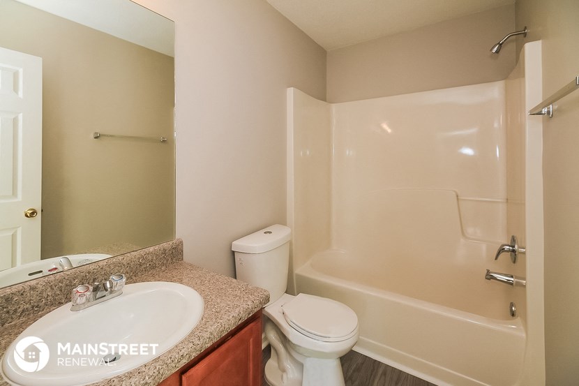 a bathroom with a sink toilet and a shower