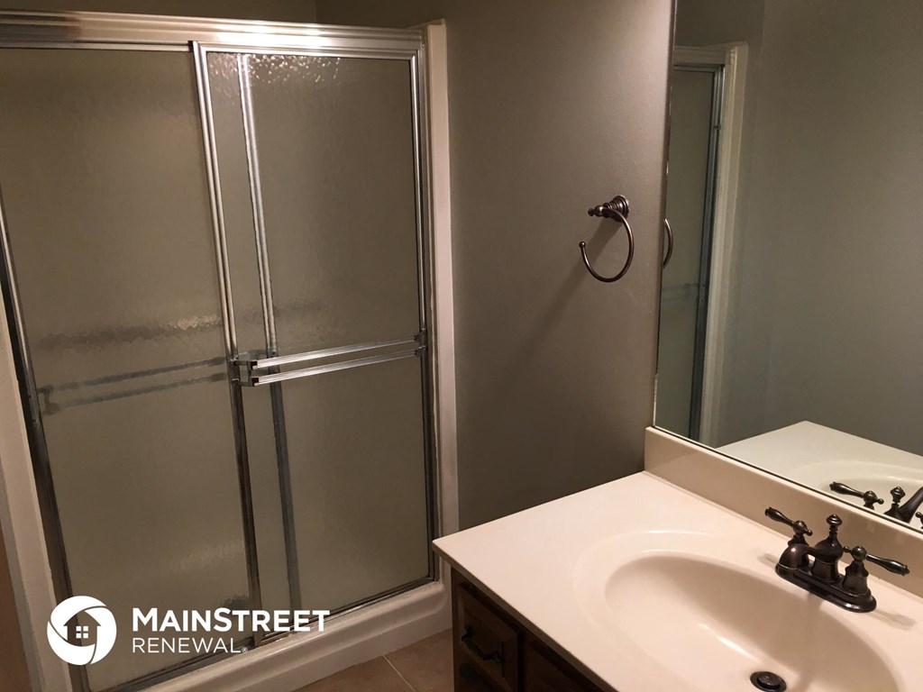 a bathroom with a sink and a shower