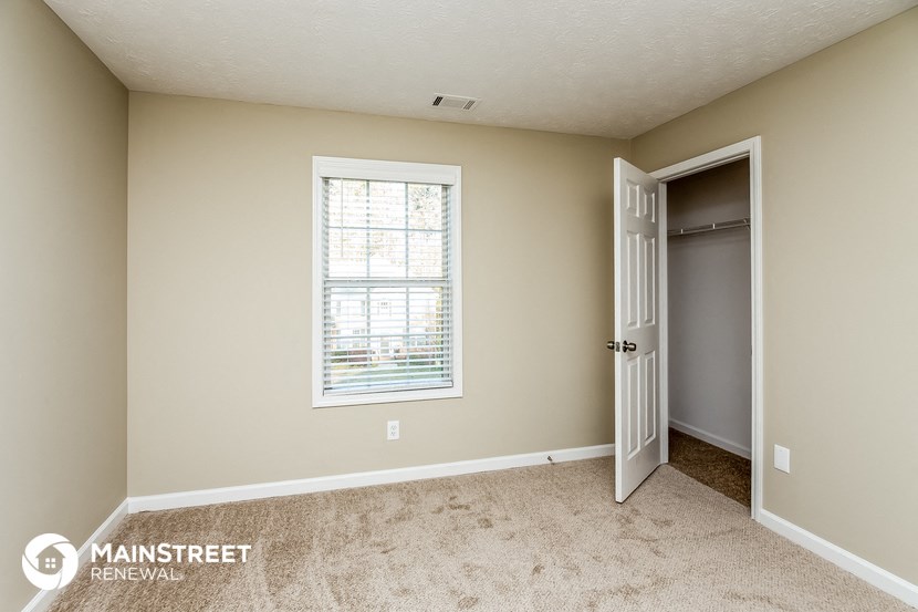 the master bedroom is spacious and has a door to the closet