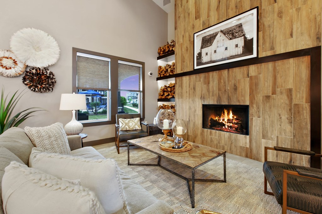 a living room with a couch and a fireplace