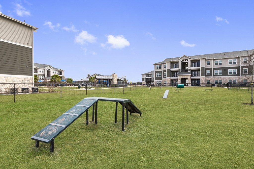 the preserve at ballantyne commons park with a seesaw in the grass