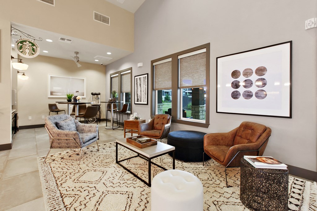 a living room with couches and chairs and a table
