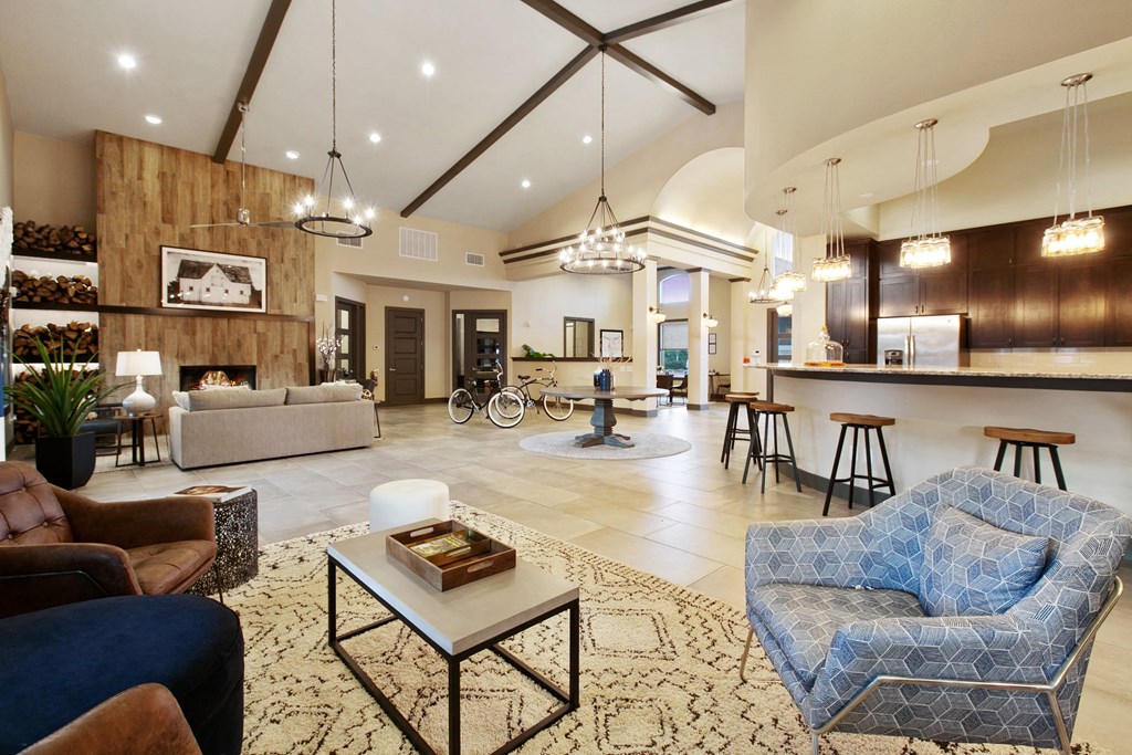 a living room with couches and chairs and a table