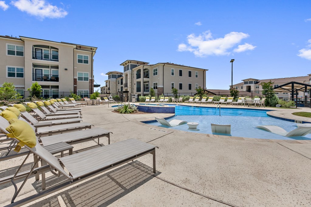 our apartments have a large swimming pool with lounge chairs