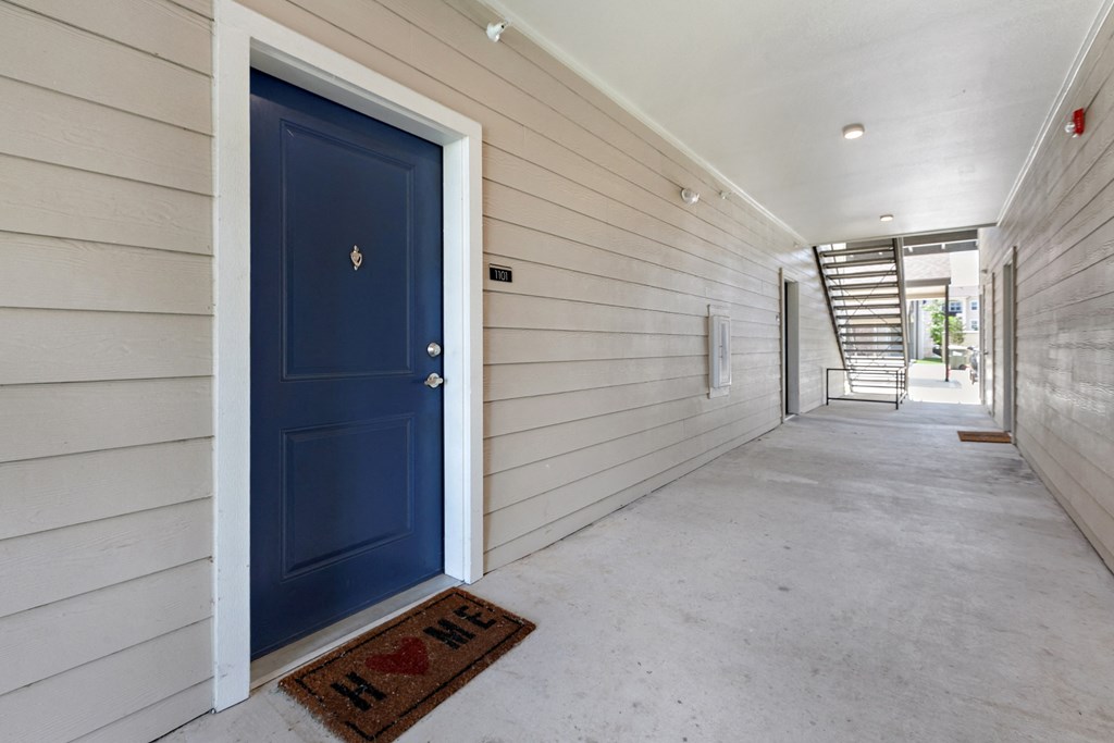 the front door of a house with a blue door
