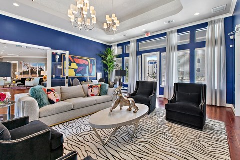 a living room with blue walls and a couch