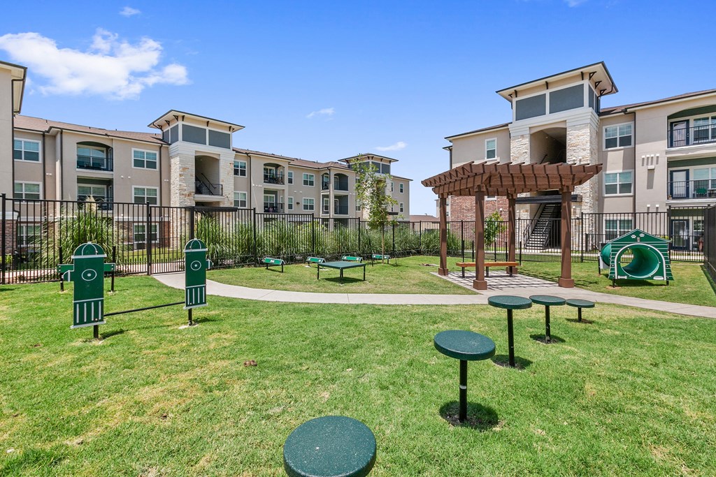 the preserve at ballantyne commons dog park with agility equipment and buildings