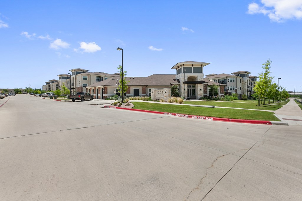 a row of apartment buildings on a city street