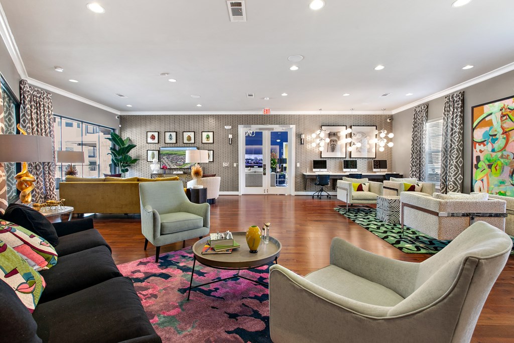 a living room with couches and chairs