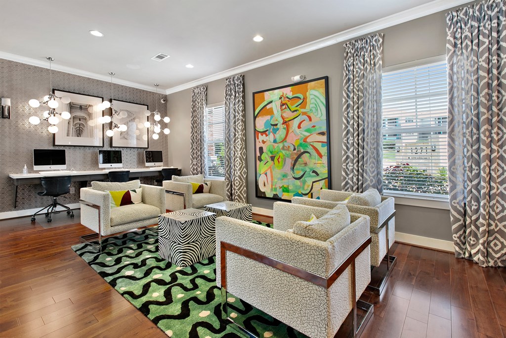 a living room with couches and chairs