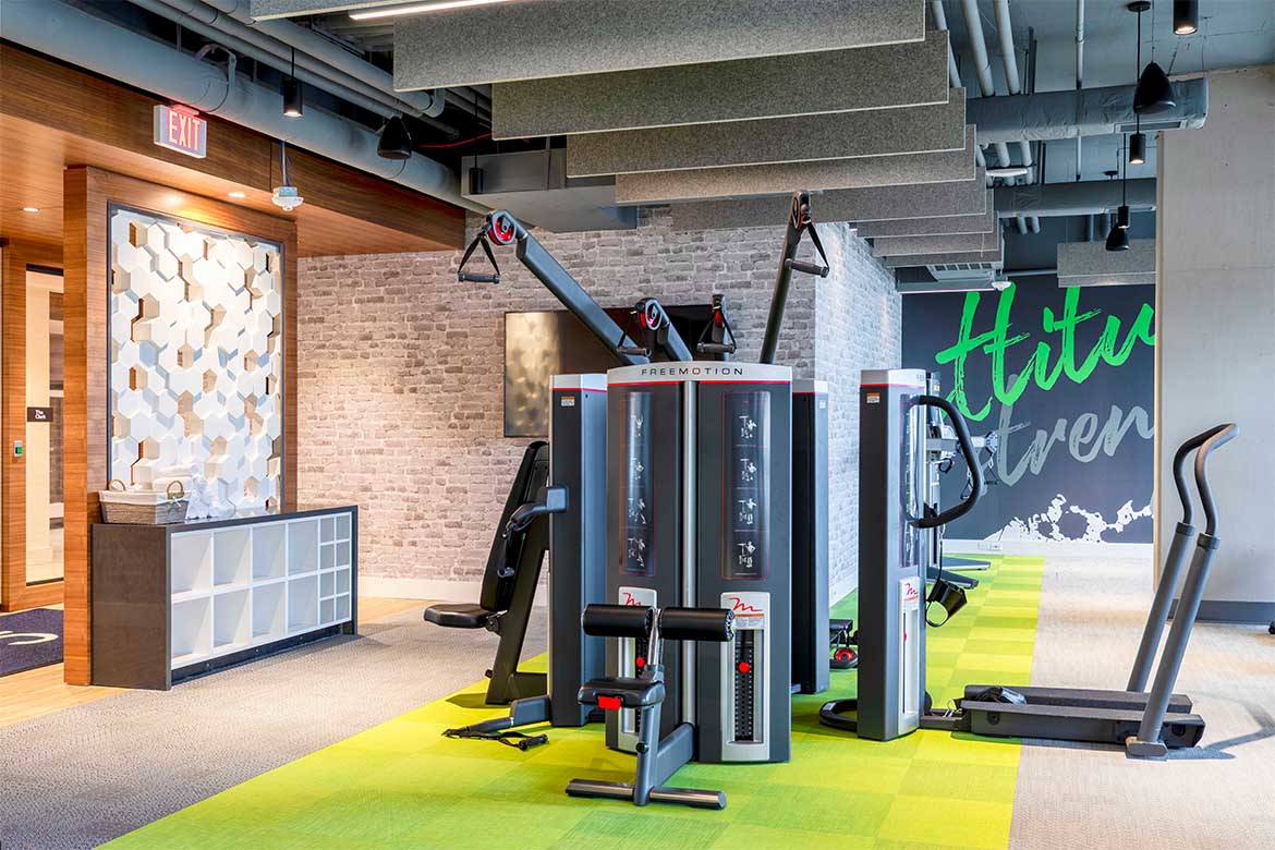 a gym with weights and other exercise equipment in a wellness center