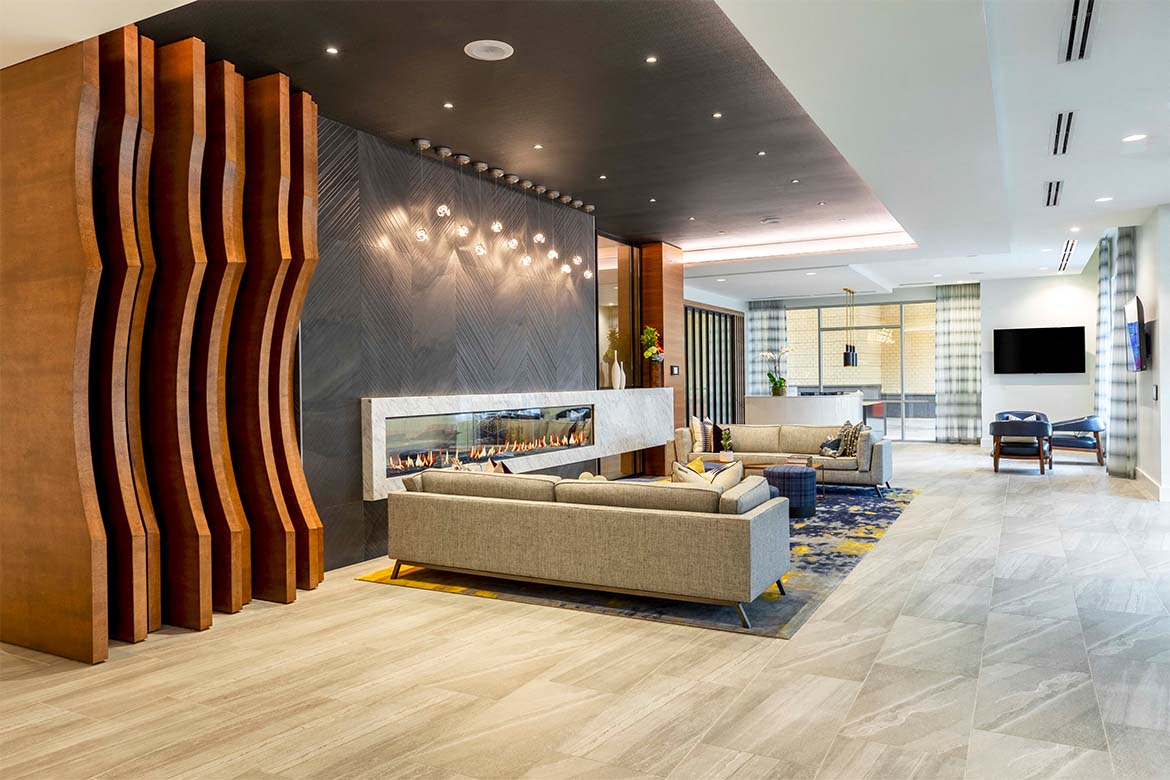 a living room with couches and a fireplace