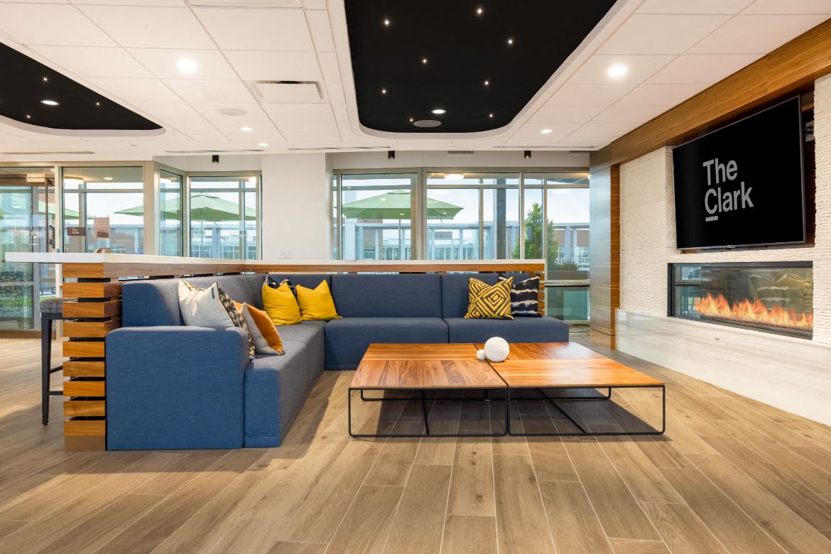 the lobby of the clark with a blue couch and a coffee table